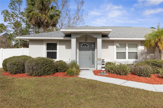 view of front of home with a front lawn