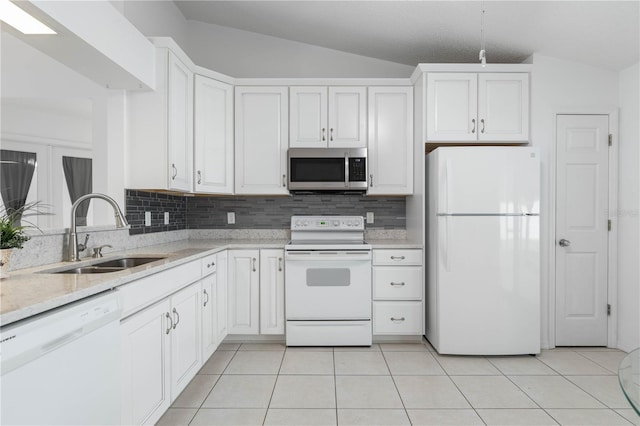 kitchen featuring white cabinetry, white appliances, sink, and vaulted ceiling