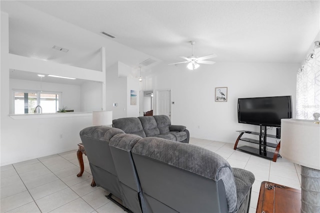 tiled living room with vaulted ceiling and ceiling fan