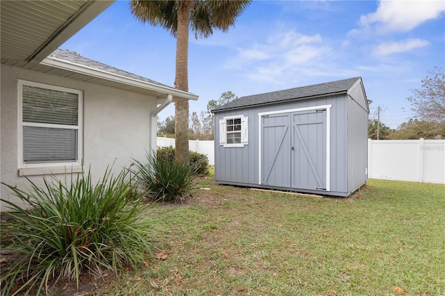 view of outdoor structure featuring a yard