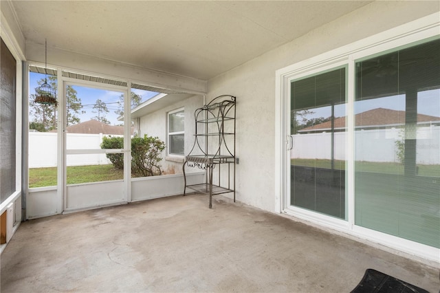 unfurnished sunroom with plenty of natural light