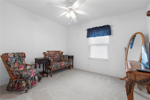 sitting room with carpet floors and ceiling fan