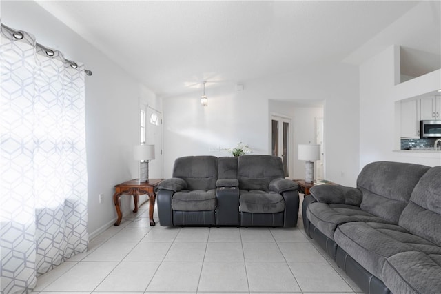 tiled living room with vaulted ceiling