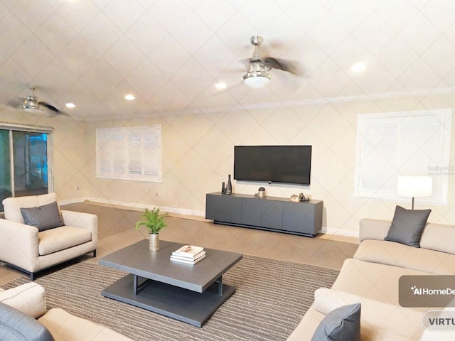 tiled living room with ceiling fan and tile walls