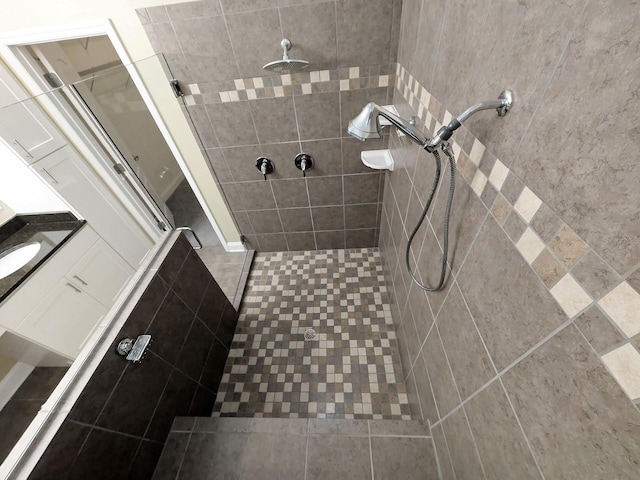 bathroom with a tile shower