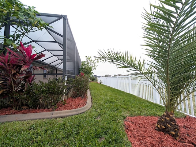 view of yard with a lanai