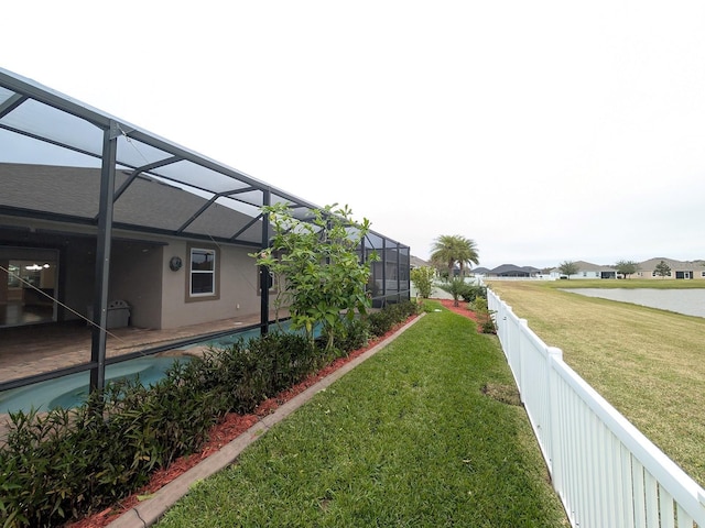 view of yard featuring a fenced in pool and a lanai