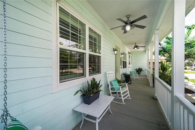 view of patio with ceiling fan and a porch