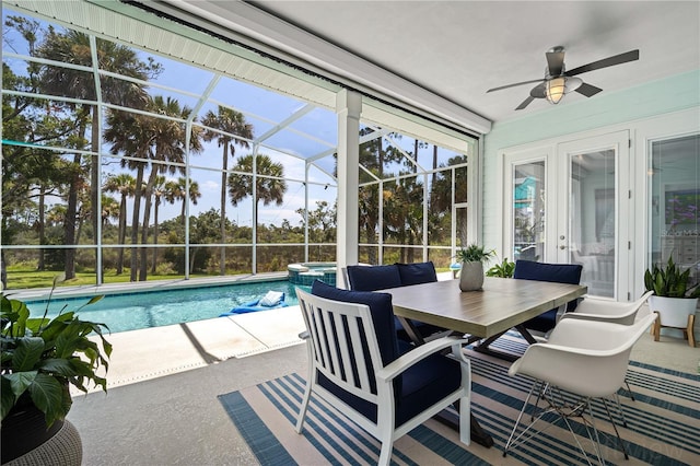 exterior space with ceiling fan, a patio area, an in ground hot tub, and a lanai