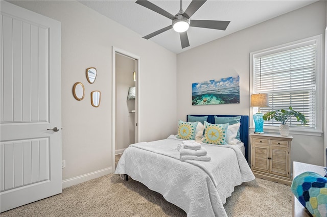 bedroom featuring ceiling fan and light carpet