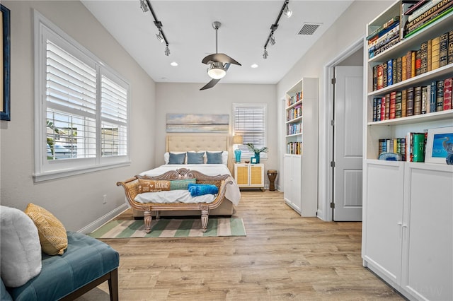 bedroom featuring ceiling fan and light hardwood / wood-style floors