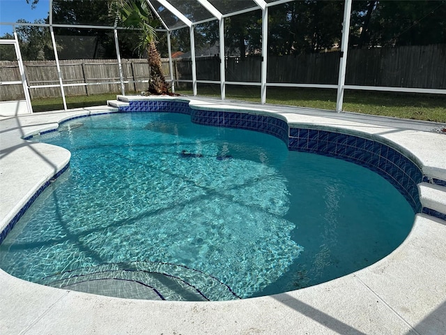 view of pool with a lanai