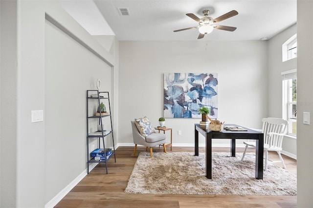 office space with ceiling fan and hardwood / wood-style floors