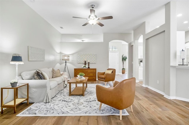 living room featuring ceiling fan and light wood-type flooring