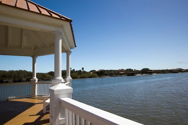 dock area with a gazebo and a water view