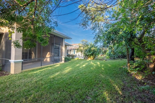 view of yard featuring a sunroom