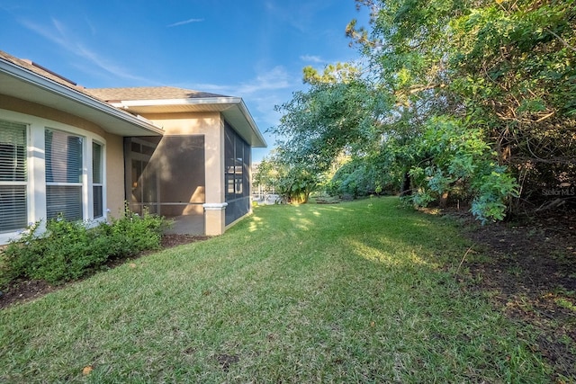 view of yard featuring a sunroom