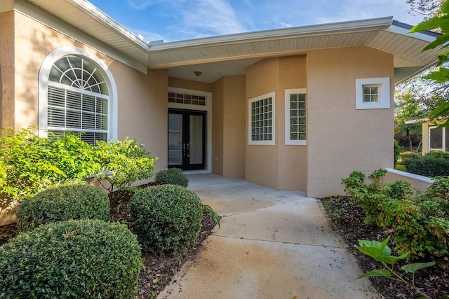 view of exterior entry featuring french doors