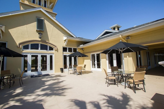 rear view of property with a patio and french doors