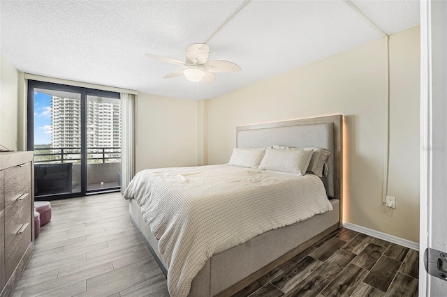 bedroom with ceiling fan and access to exterior