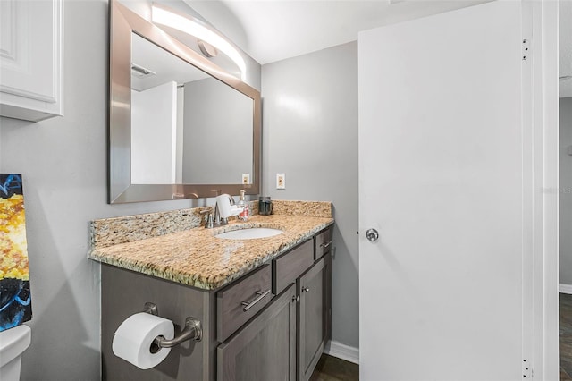 bathroom with vanity and toilet