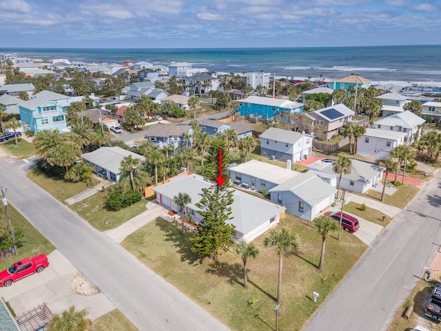 birds eye view of property with a water view and a residential view