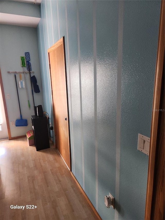 hallway featuring hardwood / wood-style floors