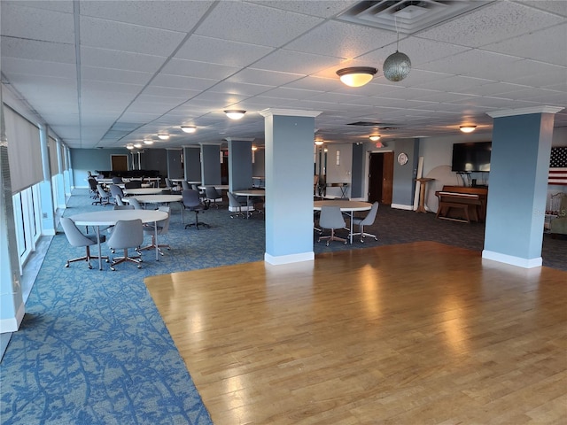 935 N Halifax Ave Unit 602, Daytona Beach, FL 32118 - dining area with baseboards, visible vents, wood finished floors, and a paneled ceiling