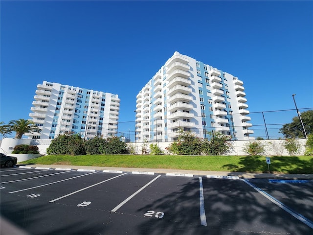935 N Halifax Ave Unit 602, Daytona Beach, FL 32118 - view of building exterior featuring uncovered parking