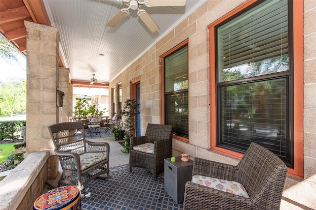 view of patio featuring ceiling fan and a porch