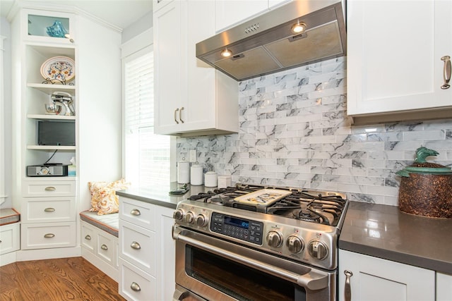 kitchen with white cabinetry, high end stainless steel range, wood-type flooring, and ventilation hood