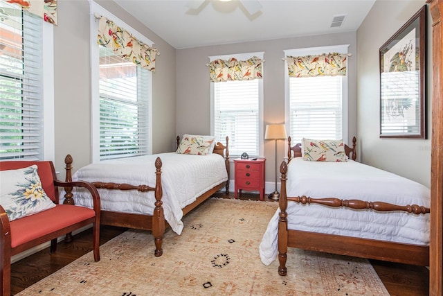 bedroom with ceiling fan and hardwood / wood-style flooring