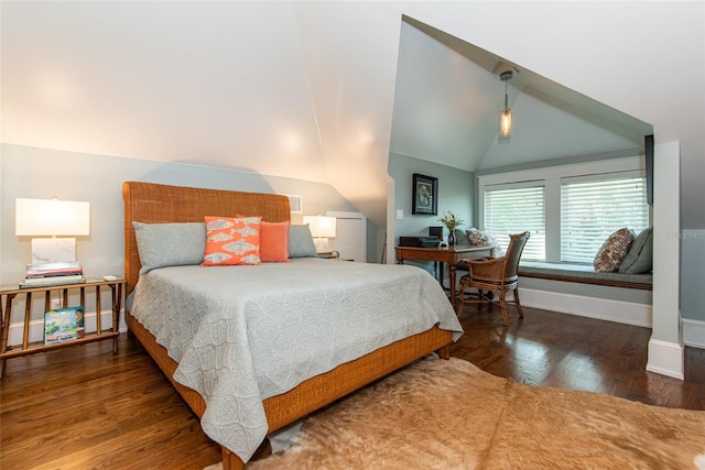 bedroom with dark hardwood / wood-style floors and vaulted ceiling