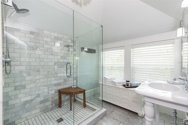 bathroom featuring sink and an enclosed shower