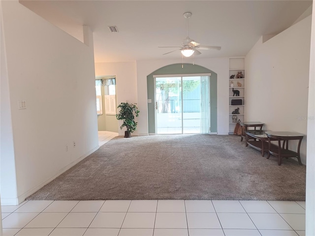 carpeted living room featuring ceiling fan and built in features