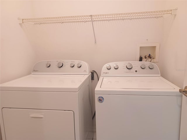 clothes washing area with washer and dryer