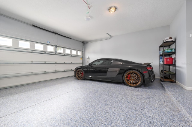 garage featuring baseboards