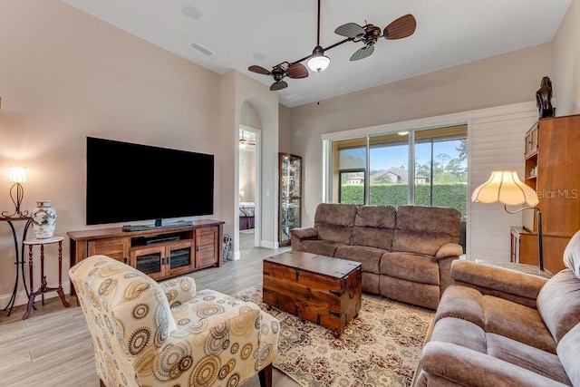 living room with ceiling fan and light hardwood / wood-style floors