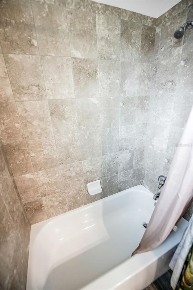 bathroom featuring shower / bath combo with shower curtain