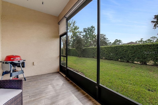 unfurnished sunroom with plenty of natural light