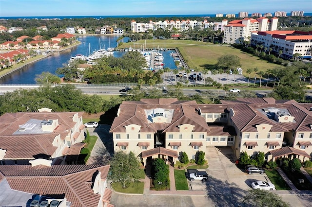 birds eye view of property with a water view