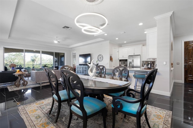 dining area with an inviting chandelier and crown molding