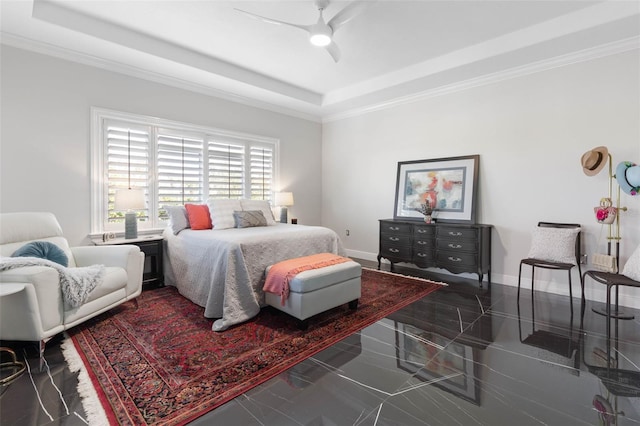 bedroom with a tray ceiling, ceiling fan, and crown molding