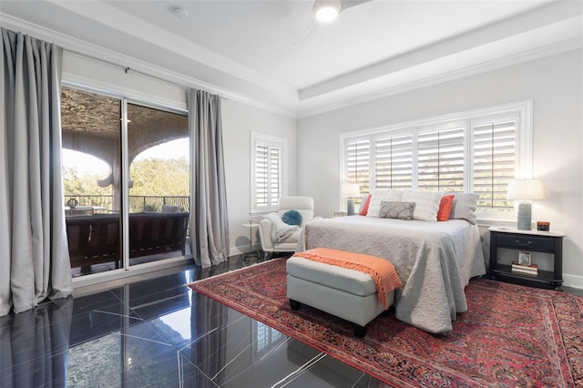 bedroom with a tray ceiling and crown molding