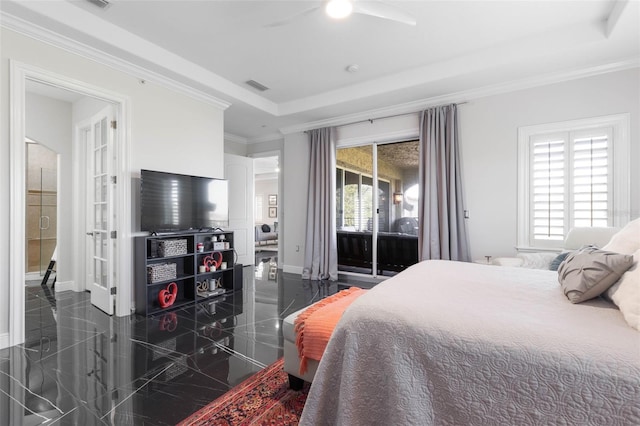 bedroom featuring a tray ceiling, ceiling fan, and crown molding