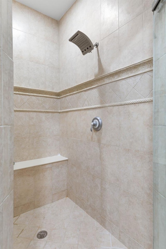 bathroom with a tile shower