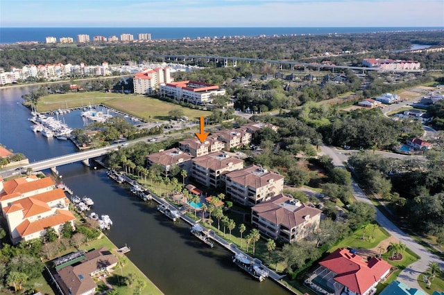 birds eye view of property featuring a water view