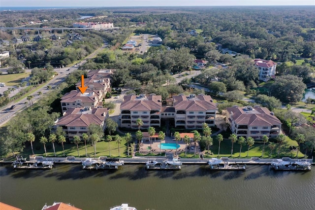 birds eye view of property with a water view