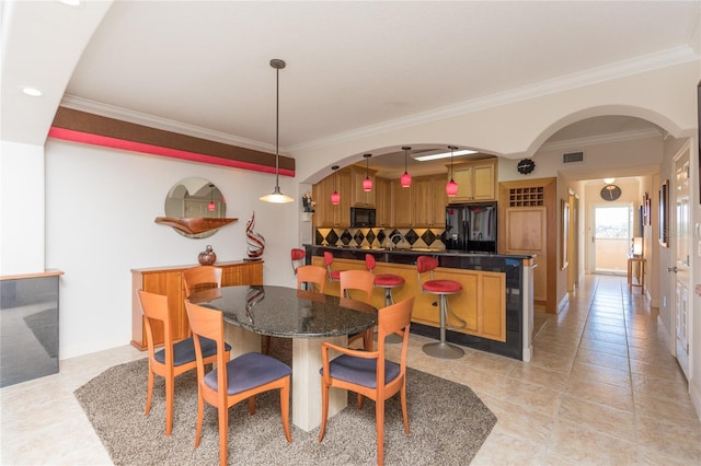 tiled dining area with ornamental molding