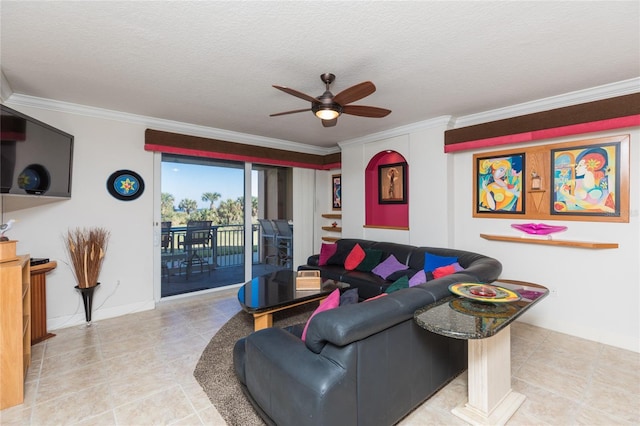 living room featuring ceiling fan, crown molding, and a textured ceiling